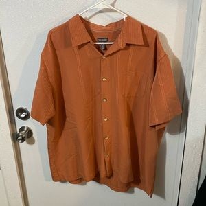 Van Huesen button up polo style dress shirt. XXL but fits more like XL.